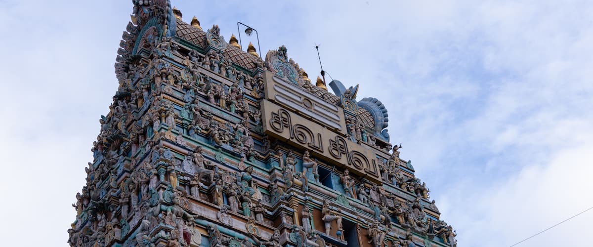 A detailed temple with intricate carvings and statues.