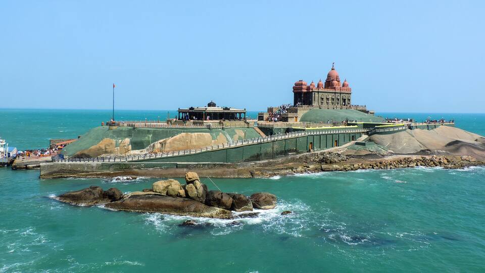 A coastal fort with a large dome and a smaller building on a rocky outcrop.