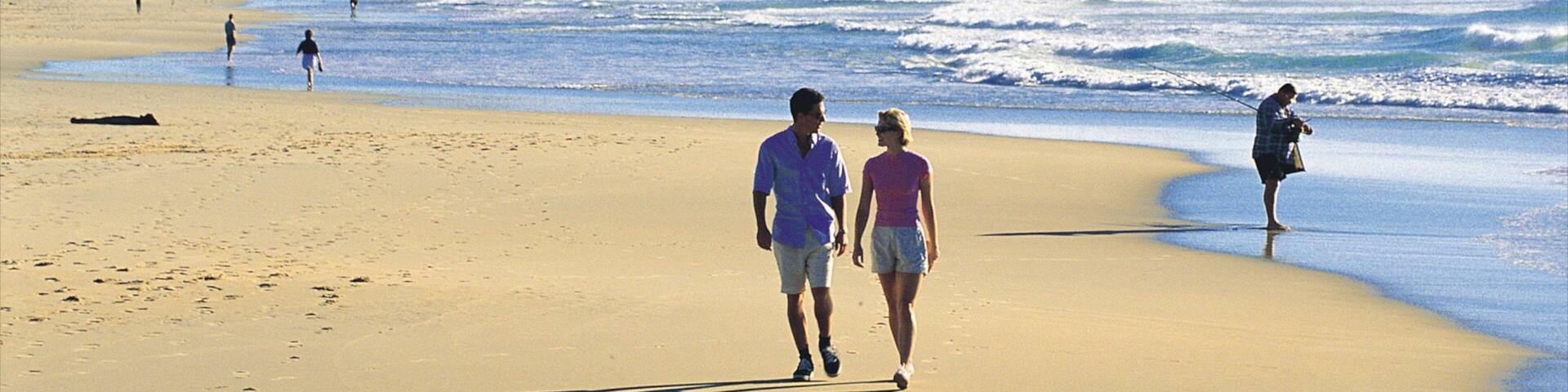 Coolum Beach which includes a sandy beach and landscape views as well as a couple