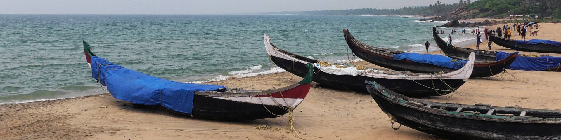 Fishing boats moored on the beach at Kovalam, Thiruvananthapuram, Kerala, India