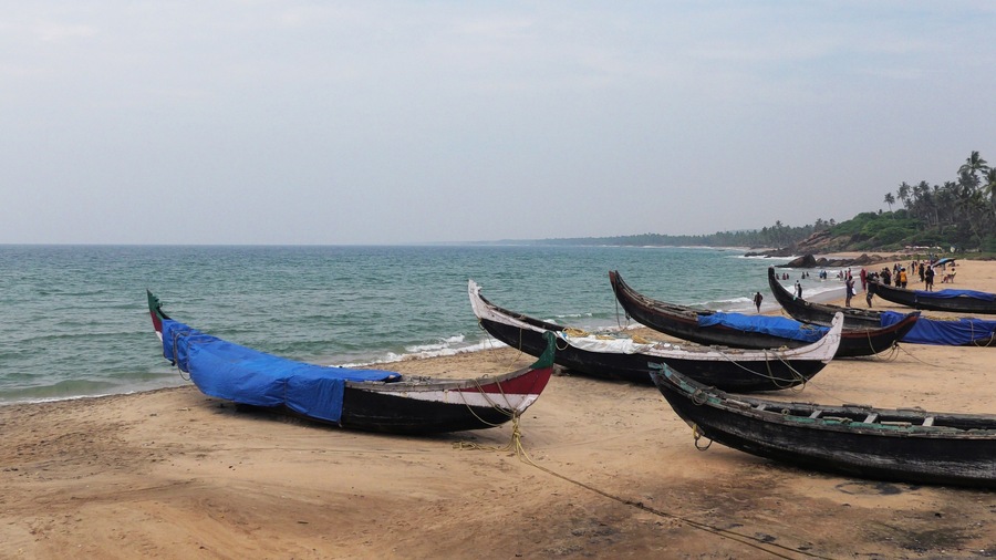 Fishing boats moored on the beach at Kovalam, Thiruvananthapuram, Kerala, India