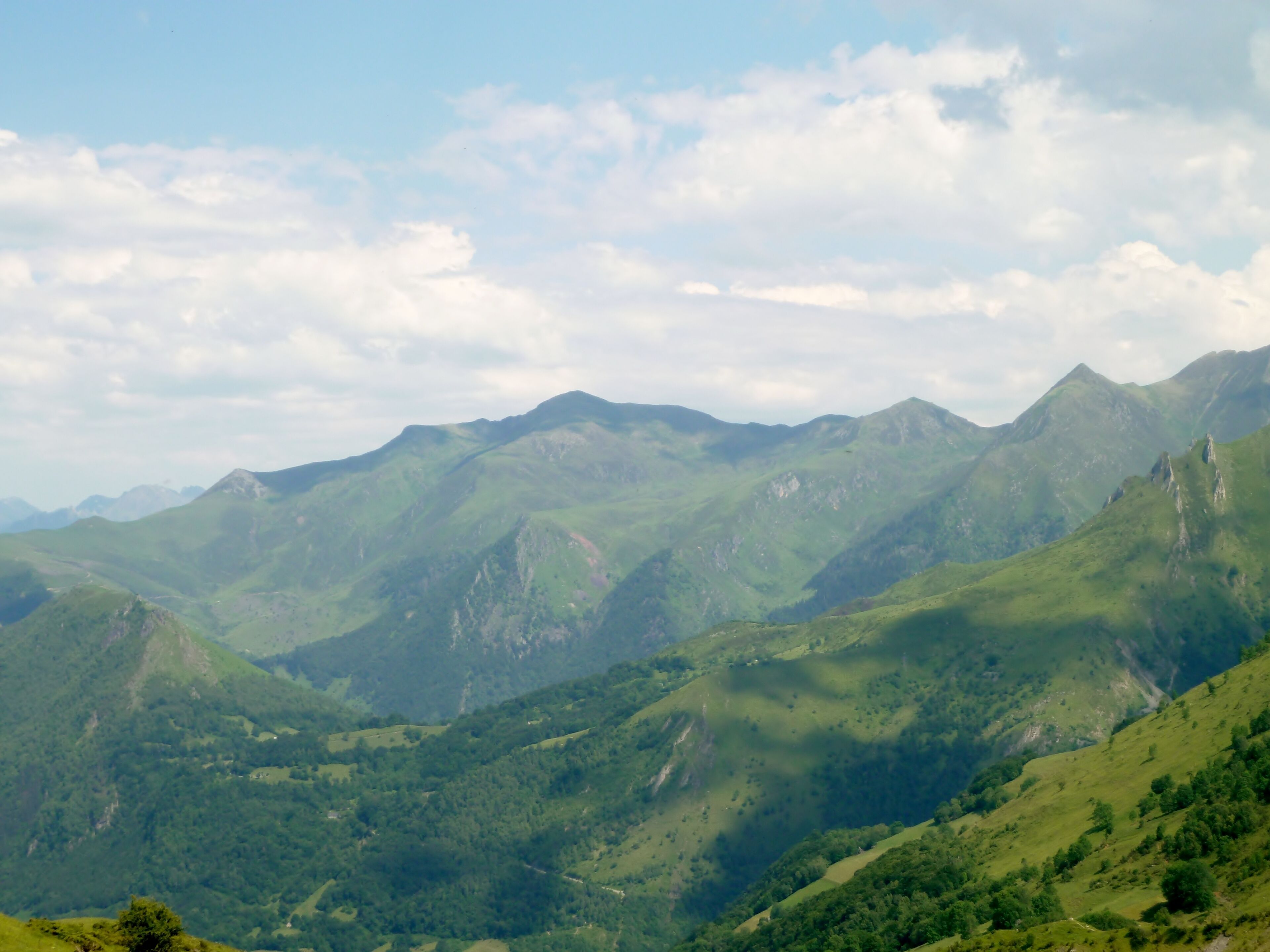 A mountainous landscape with rolling hills and valleys.