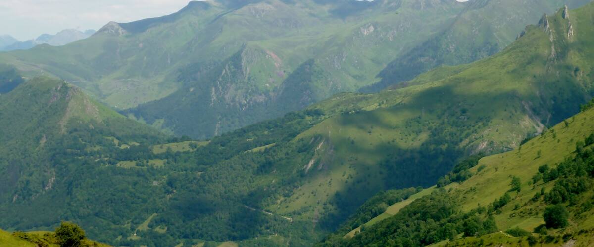 A mountainous landscape with rolling hills and valleys.