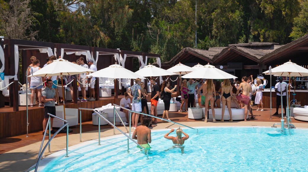 Funny Beach showing a pool and swimming as well as a couple