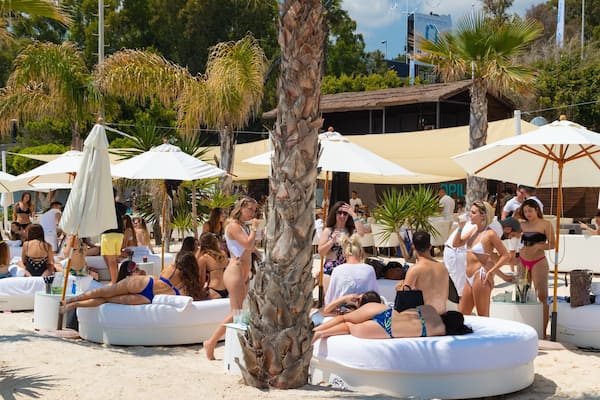 Funny Beach which includes general coastal views and a beach as well as a small group of people