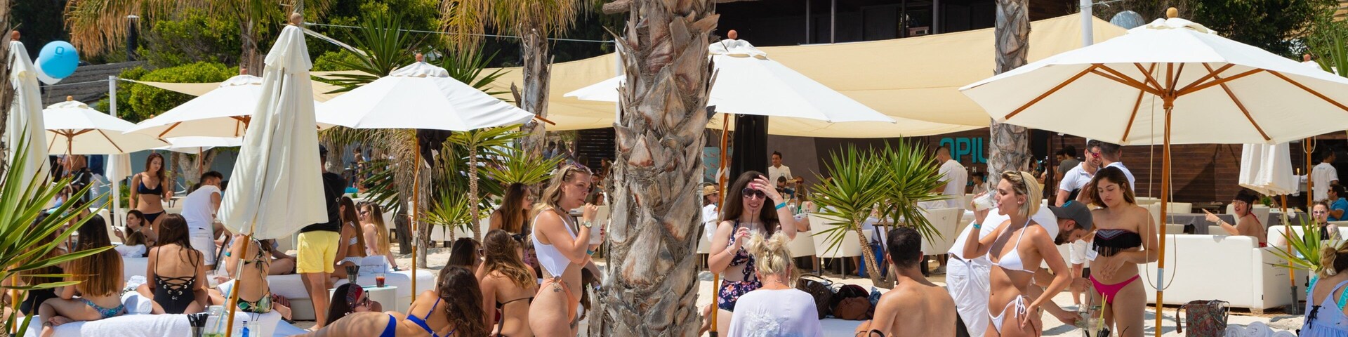 Funny Beach which includes general coastal views and a beach as well as a small group of people