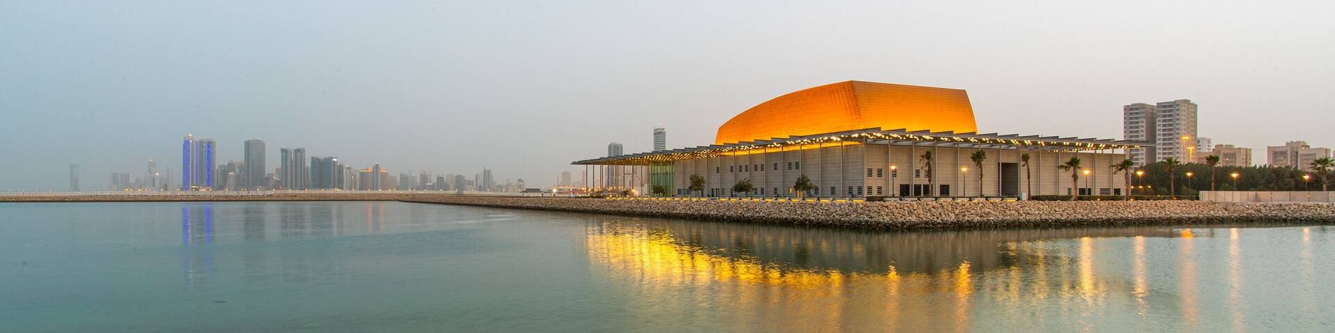 Bahrain National Theater which includes a bay or harbor