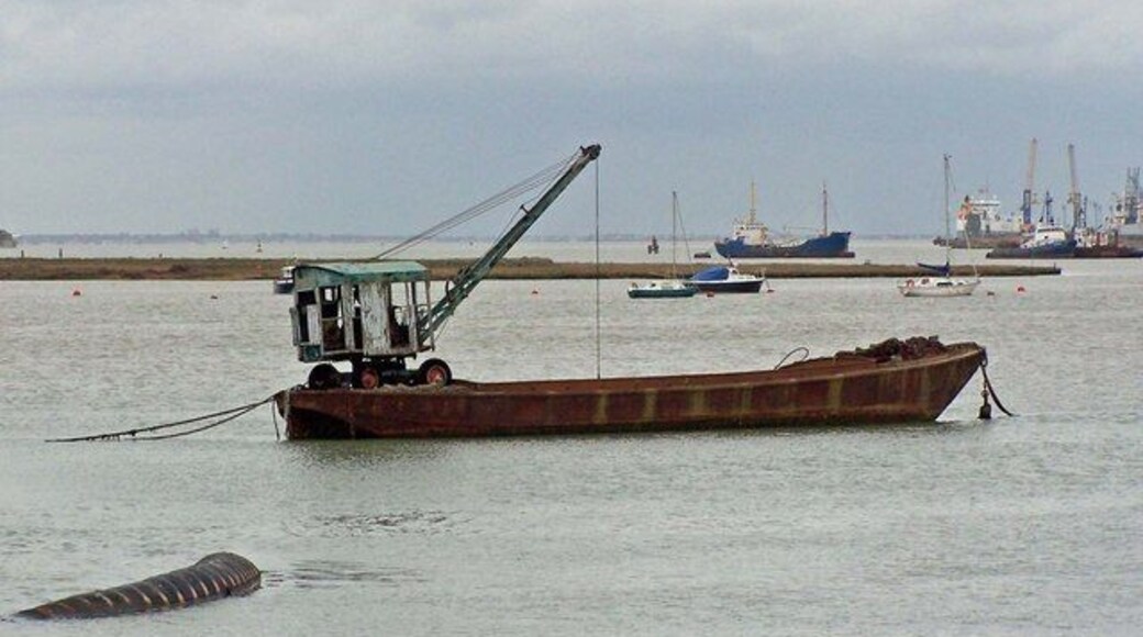 Barge with crane Moored off Rushenden Pier. The "Dinky Toy" crane looks like it might have seen better days...