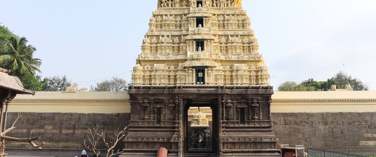 A detailed temple with intricate carvings and a large entrance.