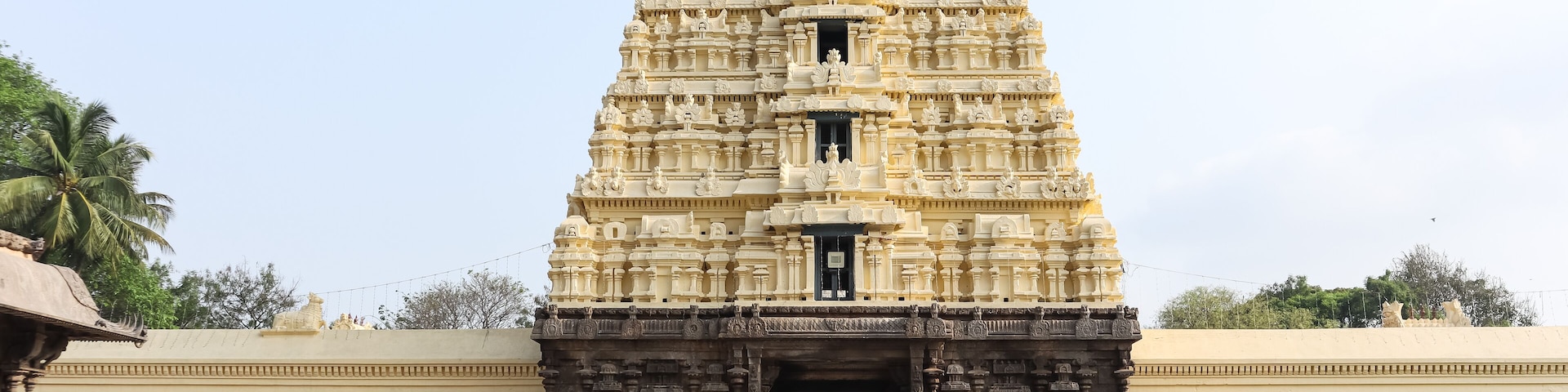 A detailed temple with intricate carvings and a large entrance.