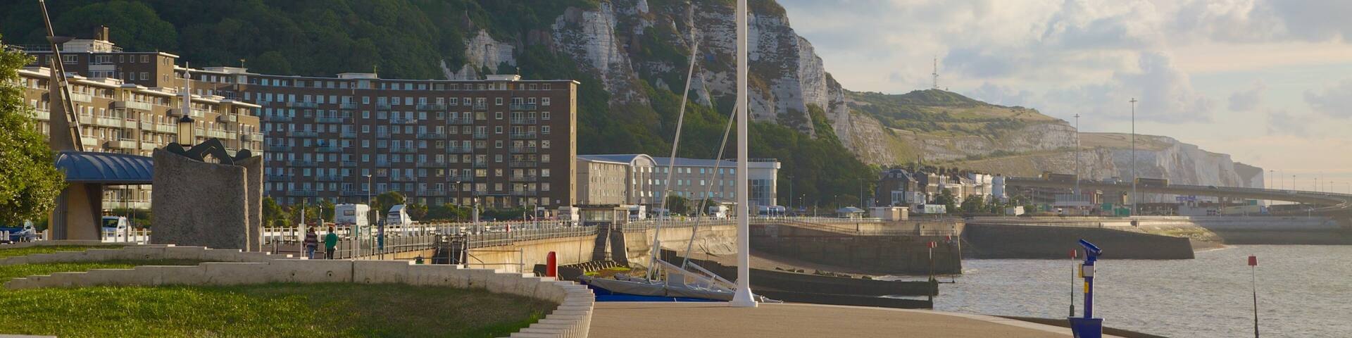 Dover Beach which includes mountains, a sandy beach and a coastal town
