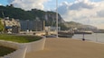 Dover Beach which includes mountains, a sandy beach and a coastal town