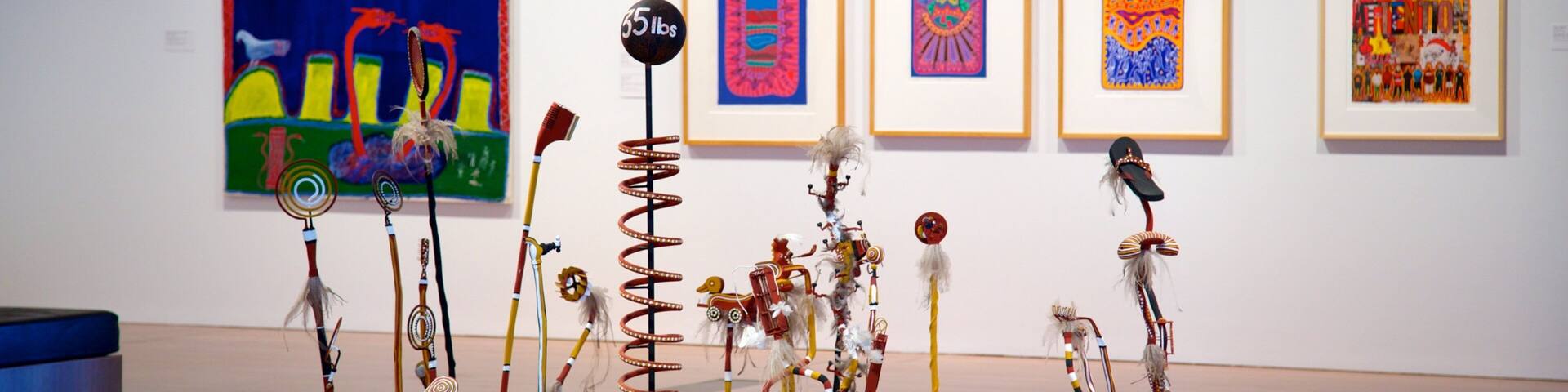 An art exhibition with colorful paintings and sculptures.