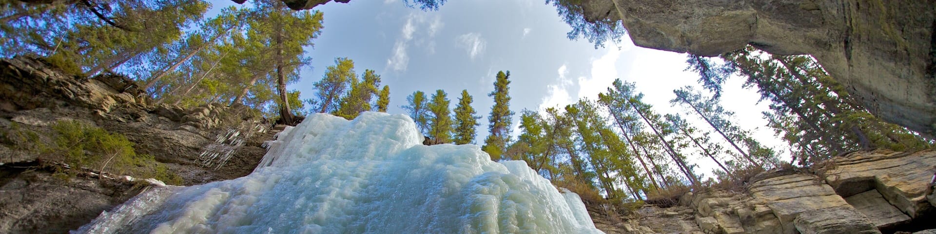 Maligne Canyon showing a gorge or canyon, snow and a cascade