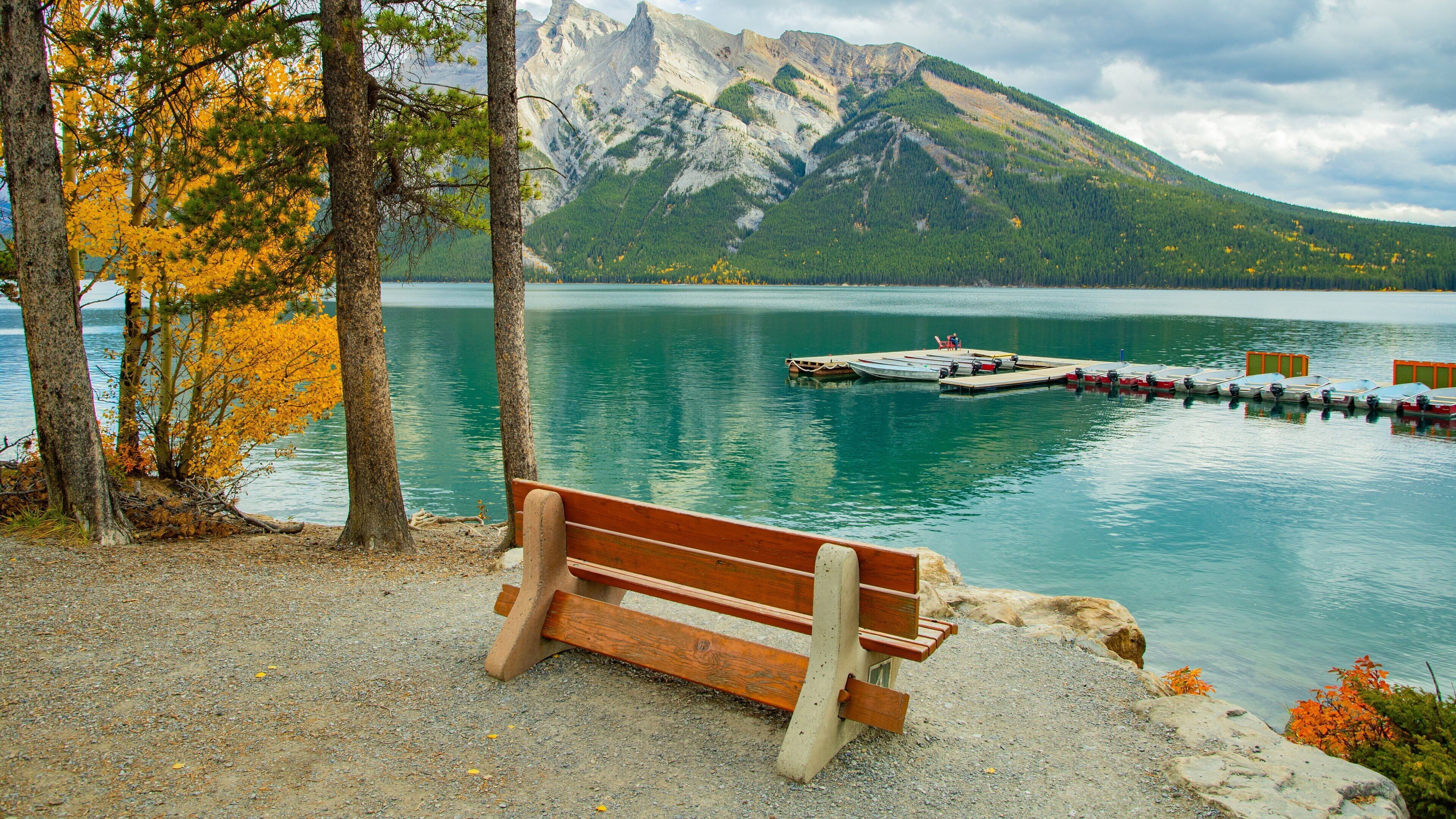 Lake Minnewanka featuring a lake or waterhole and mountains
