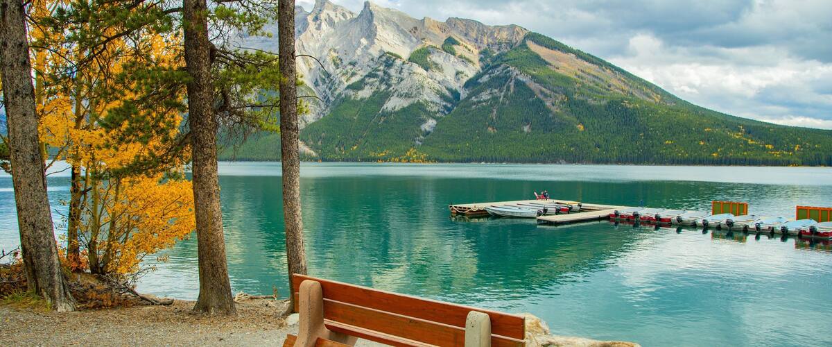 Lake Minnewanka featuring a lake or waterhole and mountains