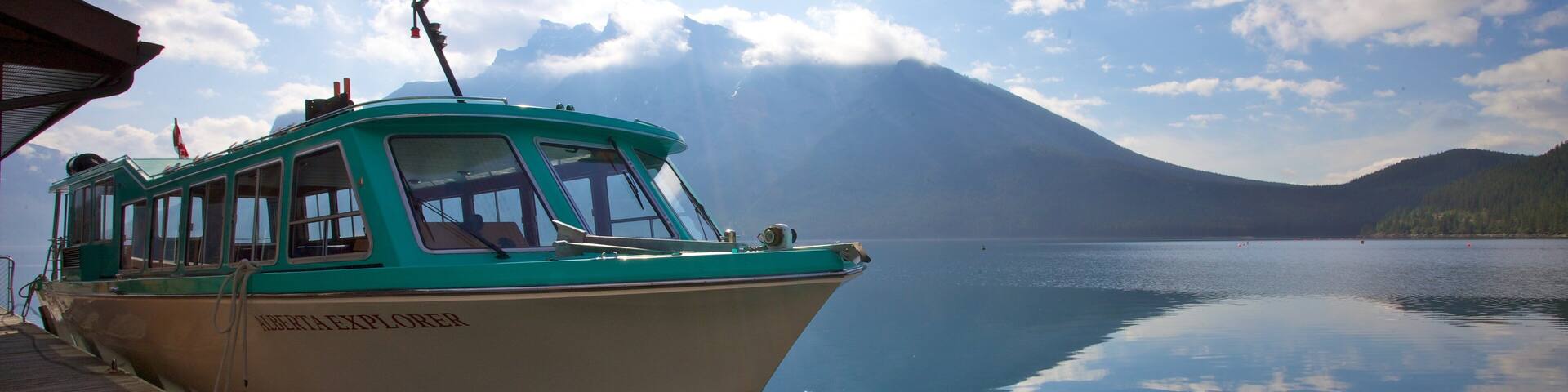Lake Minnewanka which includes landscape views, a marina and mountains