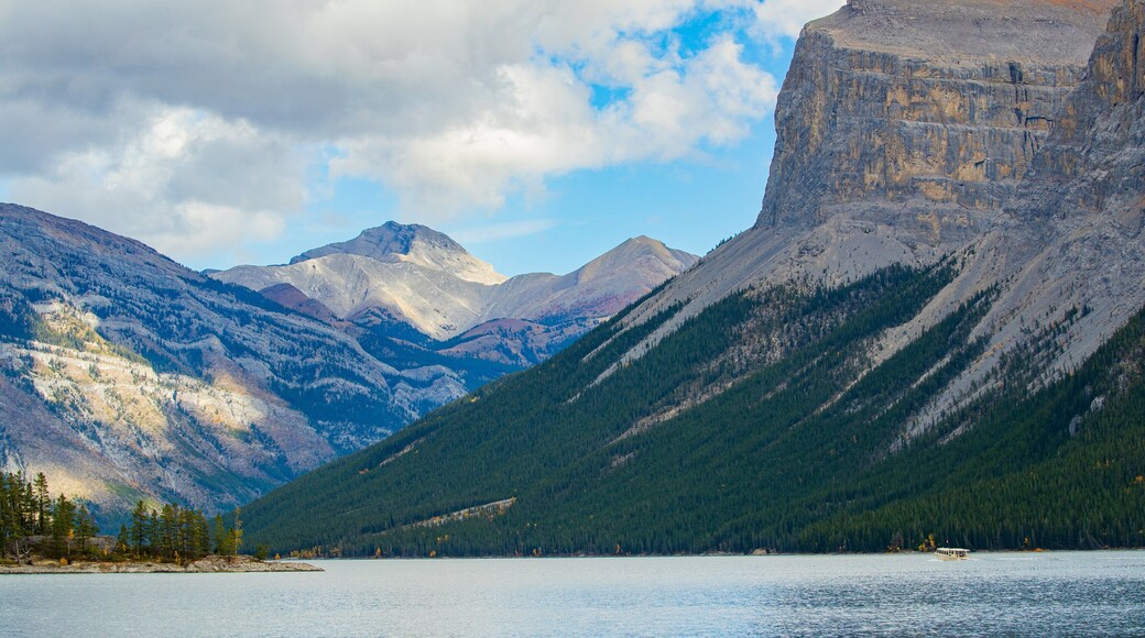 Lake Minnewanka featuring mountains and a lake or waterhole
