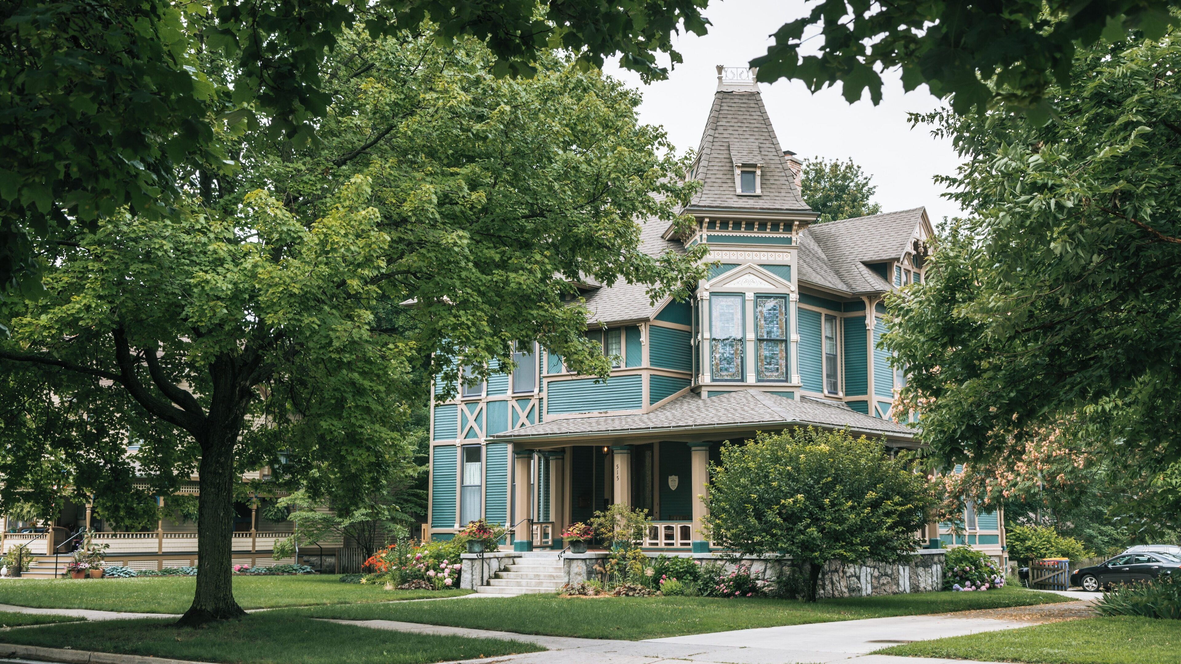 Historic architecture in Heritage Hill Historic District highlights Victorian design in Grand Rapids, Michigan during a serene afternoon