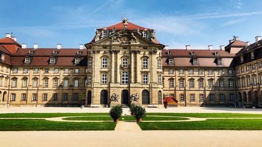 Schloss Weißenstein is a Schloss or palatial residence in Pommersfelden, Bavaria, southern Germany. It was designed for Lothar Franz von Schönborn, Prince-Bishop of Bamberg and Archbishop of Mainz, to designs by Johann Dientzenhofer and Johann Lukas von Hildebrandt. Weißenstein, built as a private summer residence, remains in the Schönborn family. It is considered a masterwork of Baroque art.