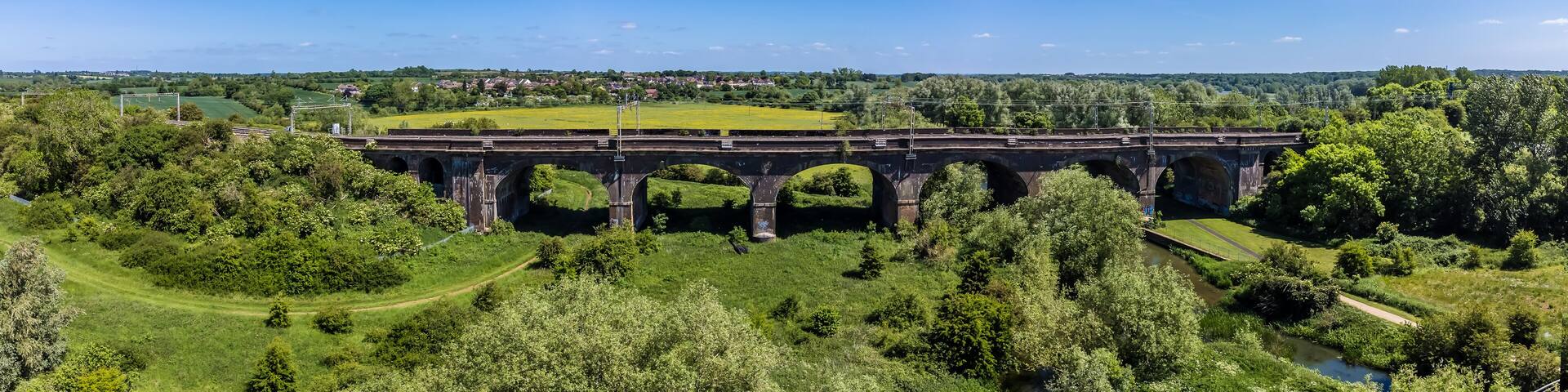 An aerial panorama view of the viaduct over the river Great Ouse at Wolverton, UK in summertime