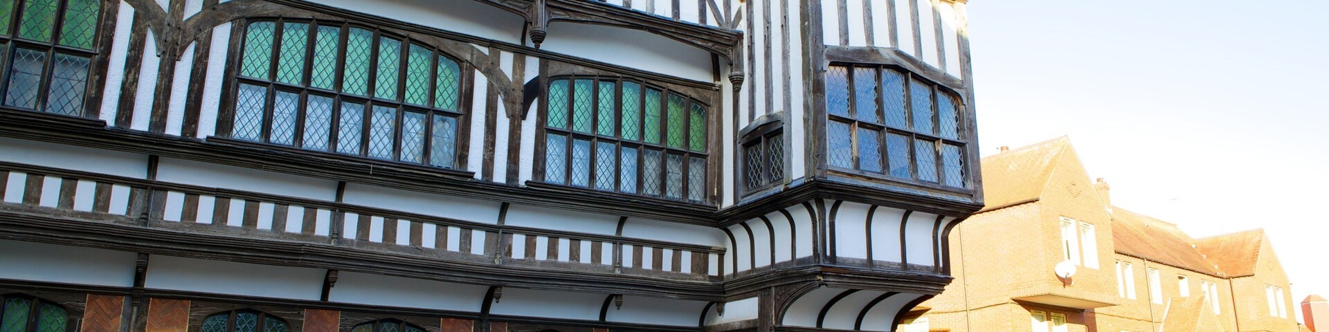 Tudor House and Garden showing heritage architecture, a small town or village and a house