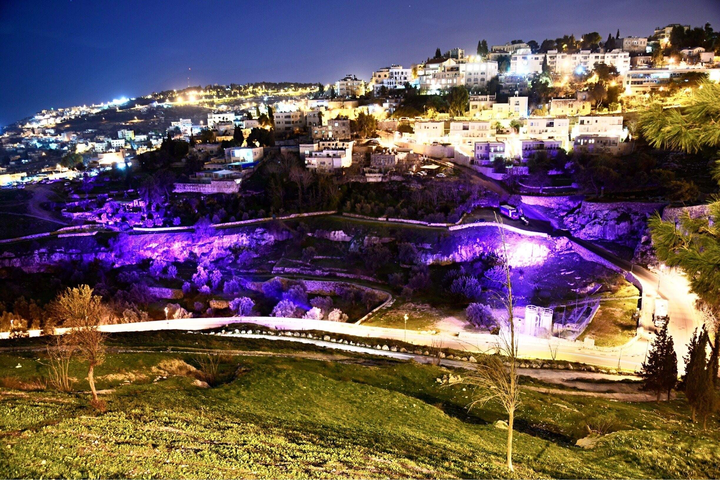 Looking down the archaeological site - City of David (עיר דוד in purple) from the Mount Zion. It located south of the Old City of Jerusalem and Temple Mount. For those walking through the City of David at night enjoy an enlightening and inspiring experience in which they witness the ancient city come to life before their very eyes in the Holy Land.
#Israel #Jerusalem #CityOfDavid #MountZion #AboveItAll #nightscape #OnTheRoad #UNESCOWorldHeritageSite