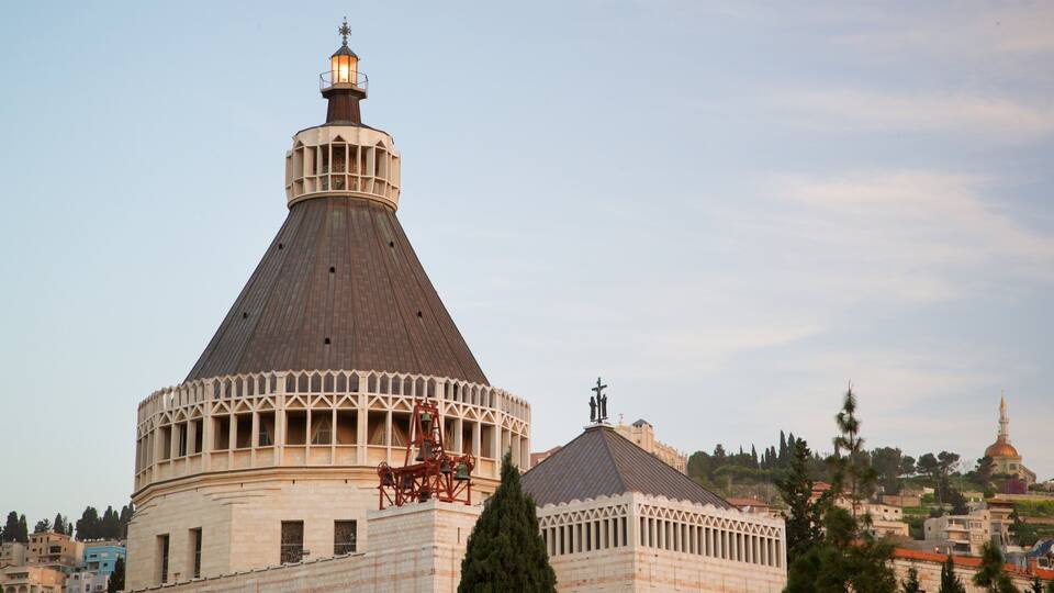 A large, historic building with a prominent dome and bell tower.