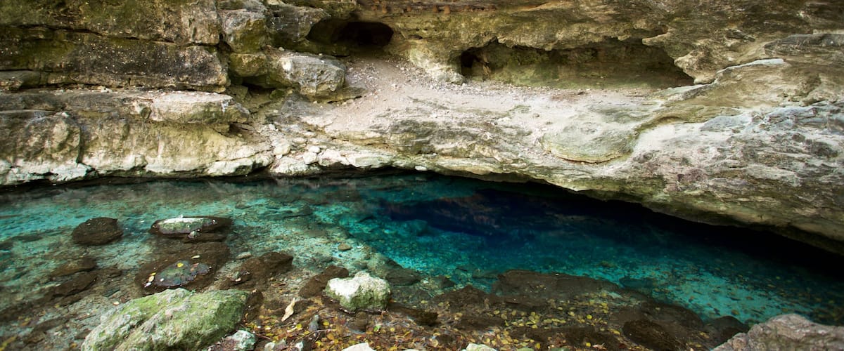 Cenote X\'batun showing a lake or waterhole