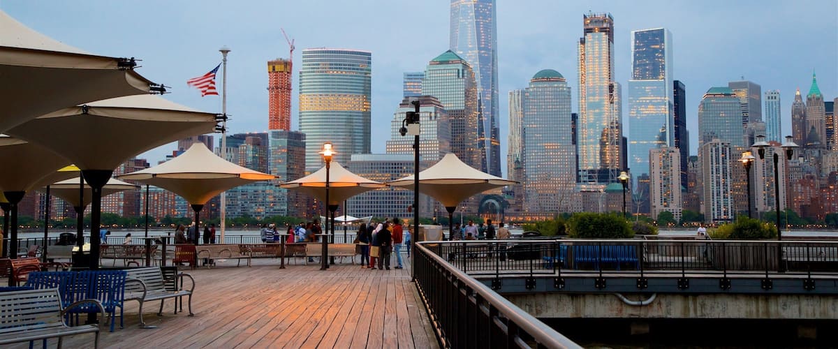 Hudson River Waterfront Walkway which includes a city, street scenes and a high rise building
