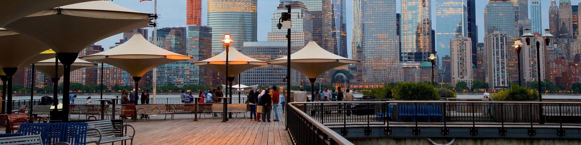 Hudson River Waterfront Walkway which includes a city, street scenes and a high rise building