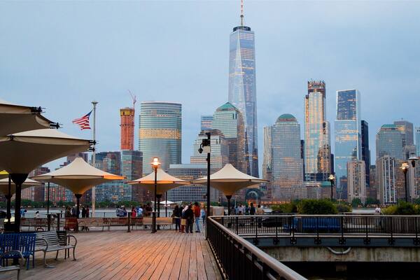 Hudson River Waterfront Walkway which includes a city, street scenes and a high rise building