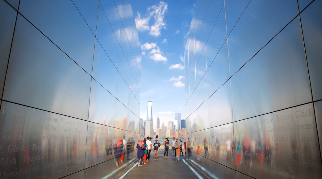 Empty Sky Memorial showing a monument as well as a large group of people