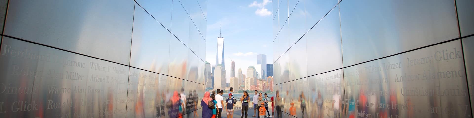 Empty Sky Memorial showing a monument as well as a large group of people