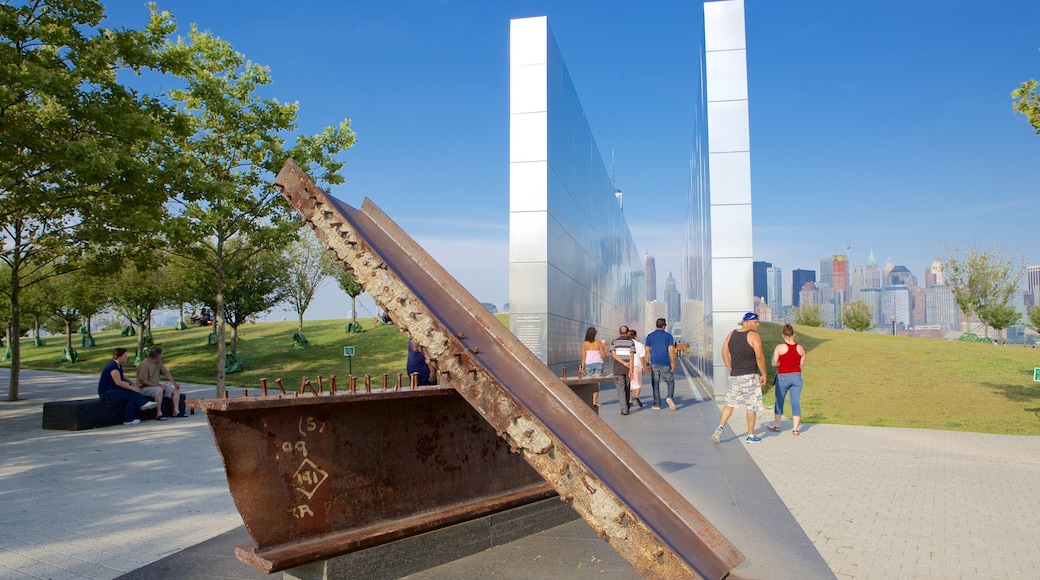 Empty Sky Memorial showing a monument as well as a large group of people