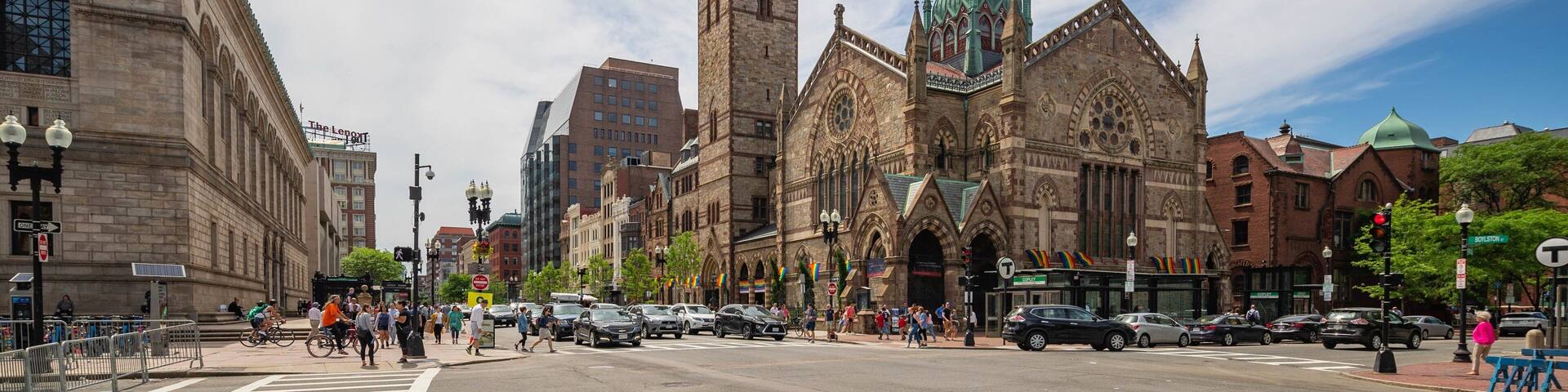 A historic church with a tall tower and stained glass windows.