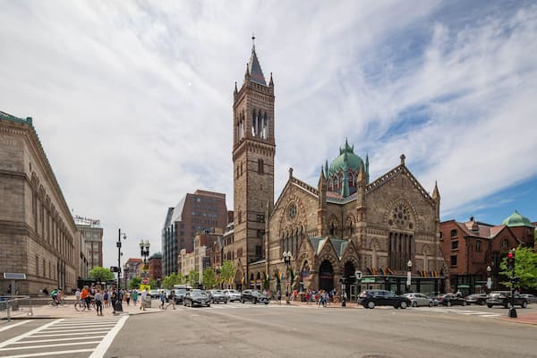A historic church with a tall tower and stained glass windows.