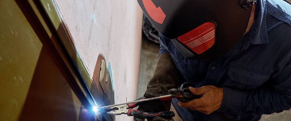 Men working. Person with face mask using welding. protection for welding work