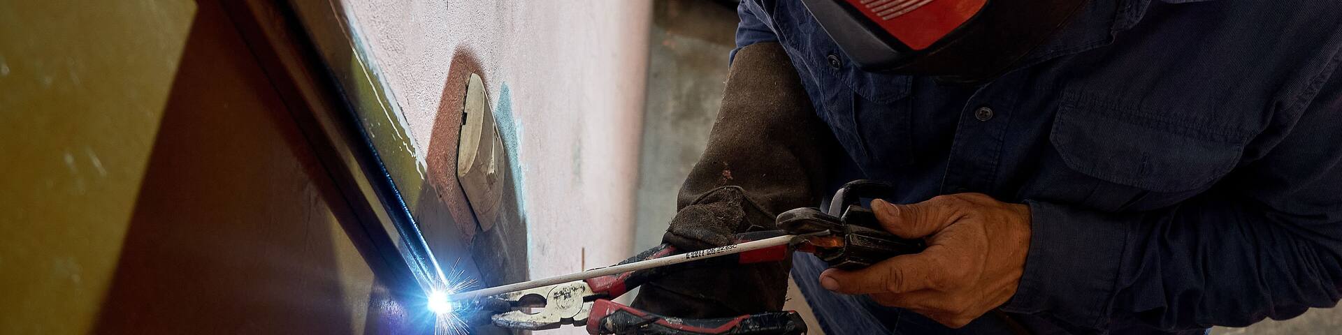 Men working. Person with face mask using welding. protection for welding work