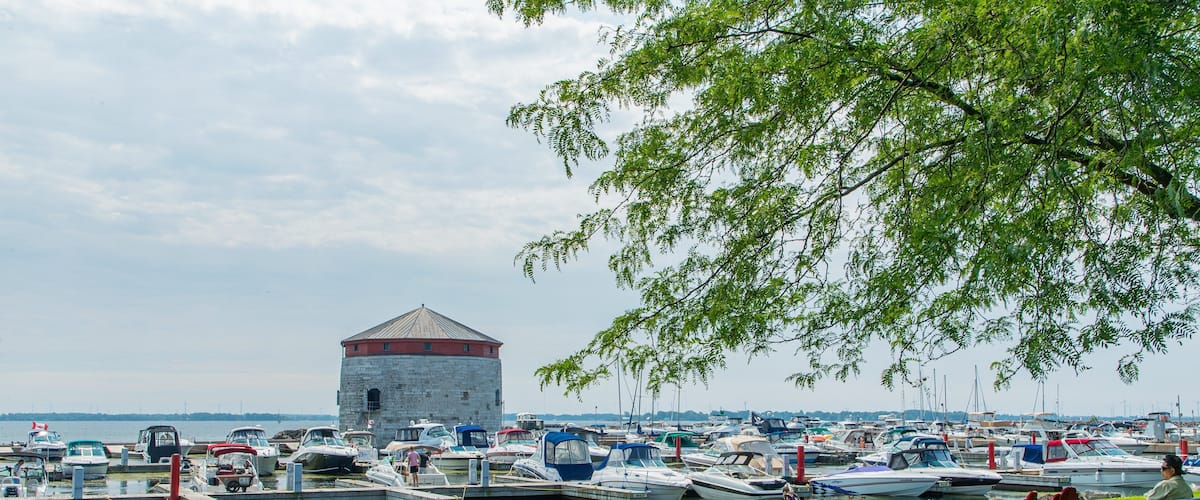 Kingston Waterfront showing a bay or harbor as well as a couple