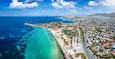 Aerial view of the beautiful coast of Voula, part of the Athens riviera, Greece, with the first public beach and turquoise sea