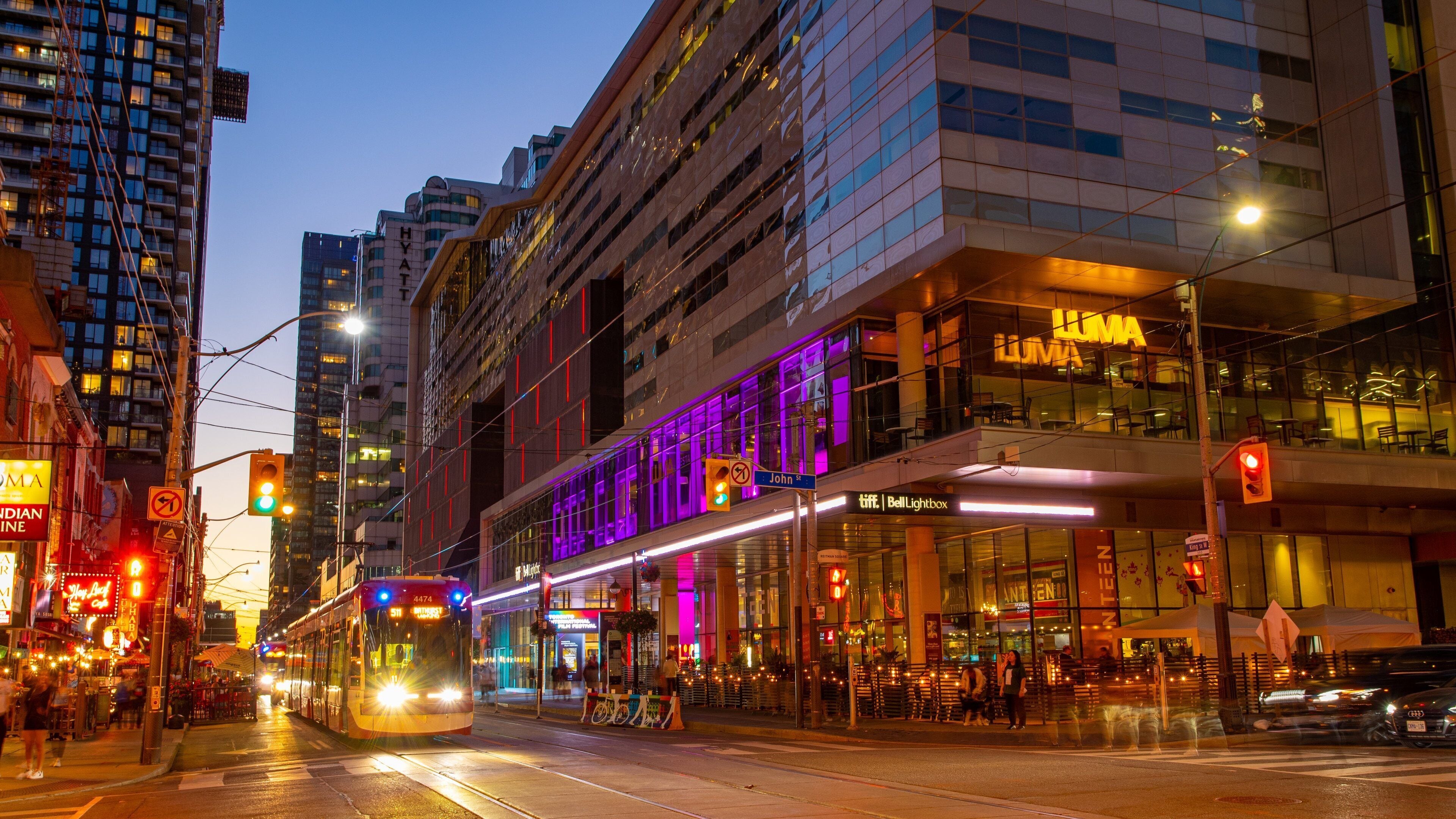 Toronto Entertainment District which includes a city and night scenes