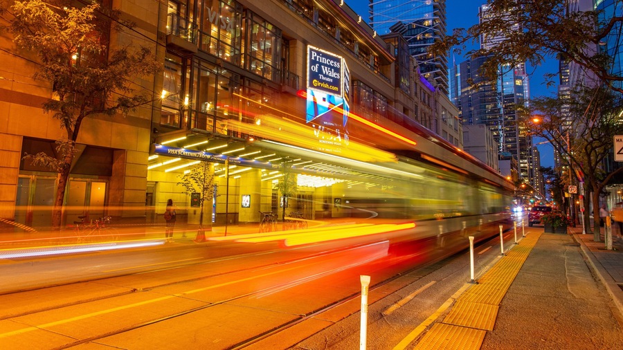 Toronto Entertainment District showing night scenes and a city