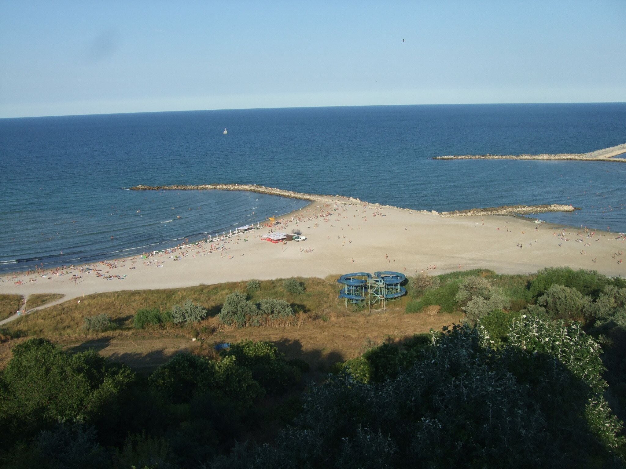 Here: you can stay all the day for sunbathing and swimming in the sea; you can watch a wide perspective to the Black Sea with ships and yachts; you are near the tourist port of Tomis, where you can go on a boat ride at sea.