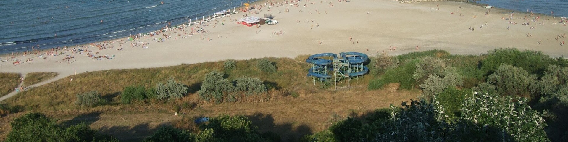 Here: you can stay all the day for sunbathing and swimming in the sea; you can watch a wide perspective to the Black Sea with ships and yachts; you are near the tourist port of Tomis, where you can go on a boat ride at sea.