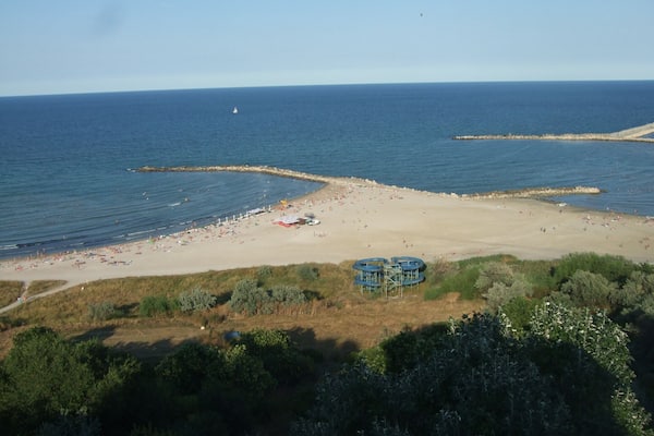 Here: you can stay all the day for sunbathing and swimming in the sea; you can watch a wide perspective to the Black Sea with ships and yachts; you are near the tourist port of Tomis, where you can go on a boat ride at sea.