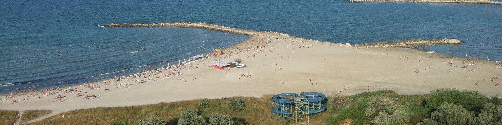 Here: you can stay all the day for sunbathing and swimming in the sea; you can watch a wide perspective to the Black Sea with ships and yachts; you are near the tourist port of Tomis, where you can go on a boat ride at sea.