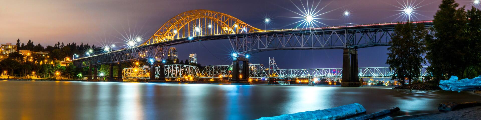 Patullo Bridge, Surrey, British Columbia, Canada. Long exposure of the bridge over the water. Sky Train Bridge.