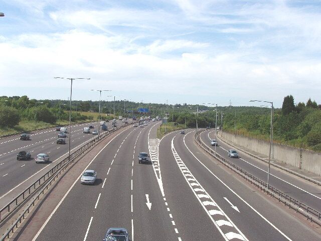 M25/M40 Motorway Junction. Taken from a bridge on a minor road, looking North-West along the M25, with traffic joining from the M40