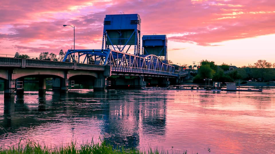 Lewiston - Clarkston blue bridge against vibrant twilight sky